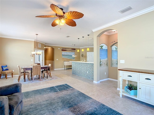 tiled living room featuring crown molding and ceiling fan with notable chandelier