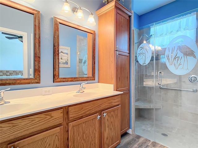 5255 Athens Way, Venice, FL 34293 - bathroom featuring a stall shower, double vanity, and wood finished floors