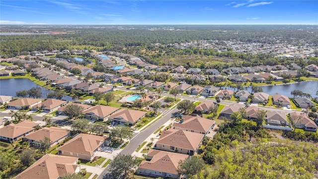 birds eye view of property featuring a residential view and a water view