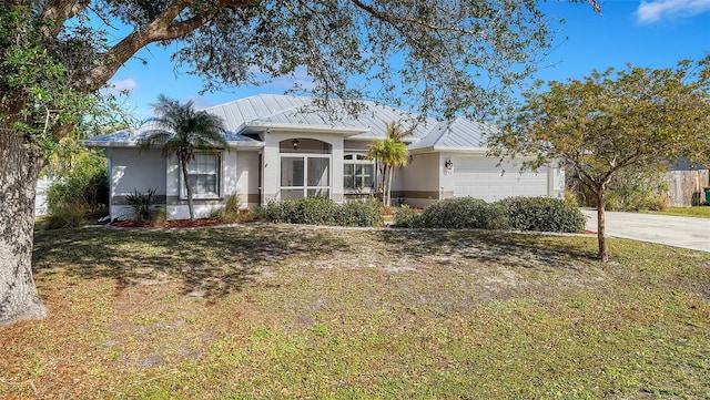 ranch-style house with a garage and a front yard