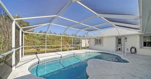 view of pool featuring a patio area and a lanai