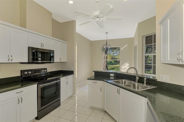 kitchen featuring appliances with stainless steel finishes, white cabinetry, and sink