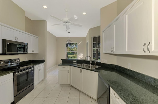 kitchen with white cabinets, stainless steel appliances, light tile patterned flooring, and sink