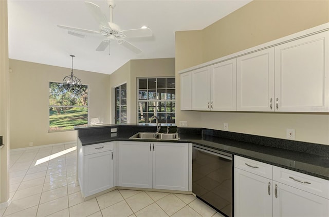 kitchen featuring white cabinetry, sink, light tile patterned floors, and stainless steel dishwasher