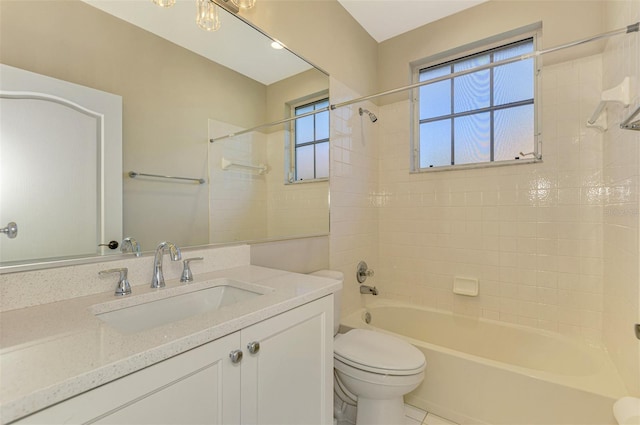 full bathroom featuring vanity, toilet, and tiled shower / bath