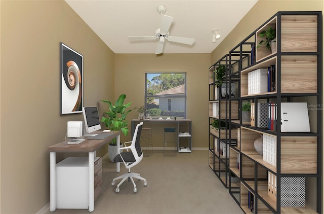 carpeted office space featuring ceiling fan