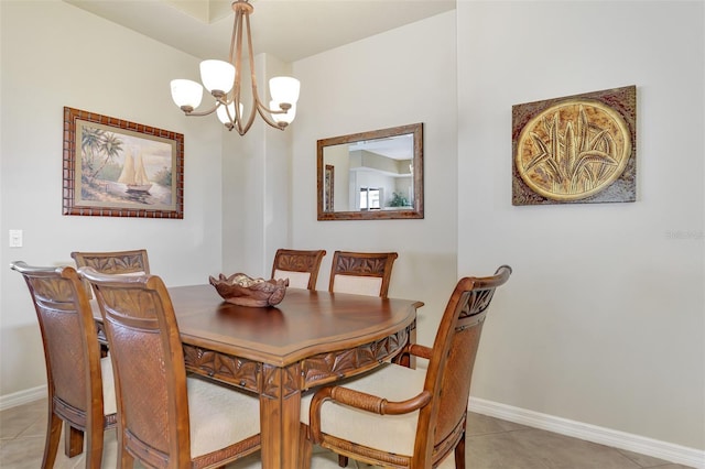 tiled dining area featuring an inviting chandelier