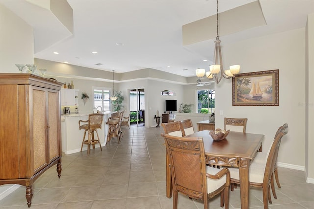 dining space with a notable chandelier and light tile patterned floors