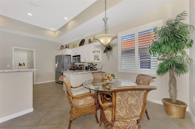 dining area with light tile patterned floors