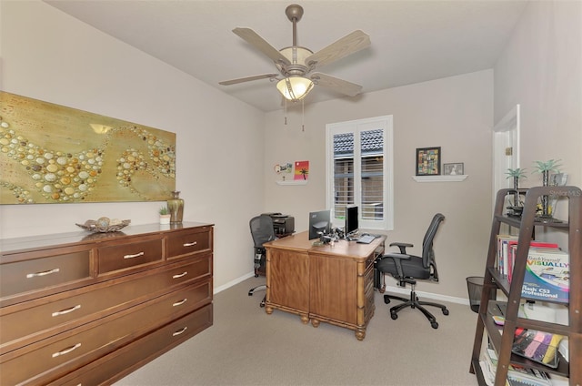 carpeted office with ceiling fan