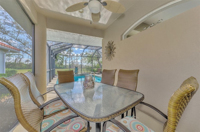 sunroom / solarium featuring a pool and ceiling fan