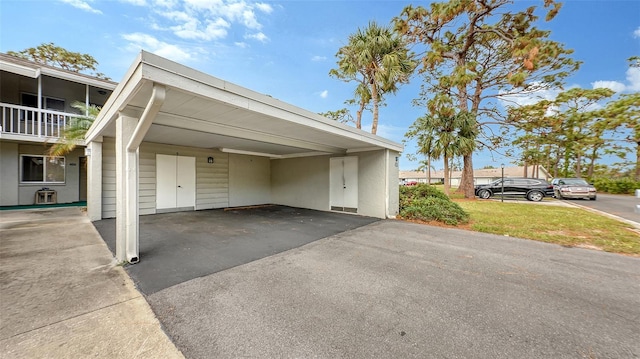 view of vehicle parking with a carport