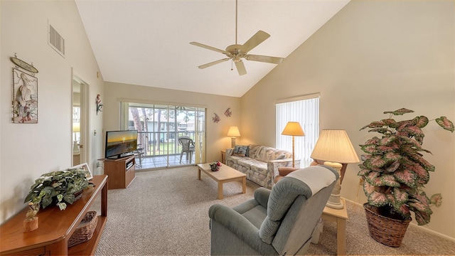 carpeted living room featuring ceiling fan and high vaulted ceiling