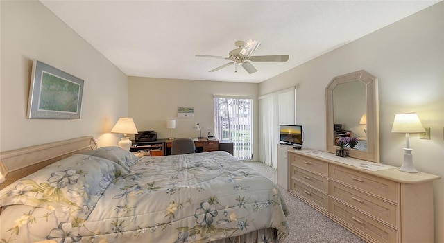 bedroom with ceiling fan and light colored carpet