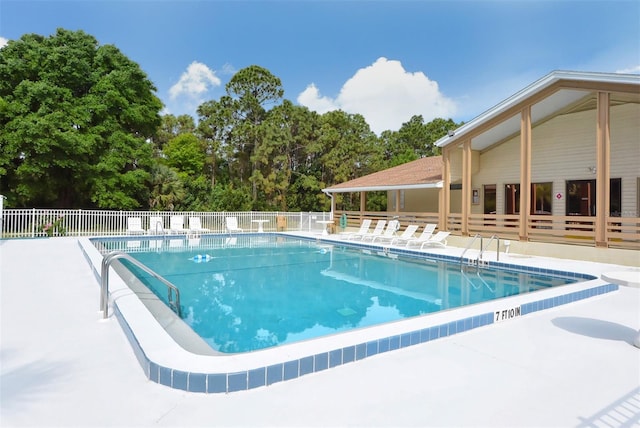 view of swimming pool with a patio area