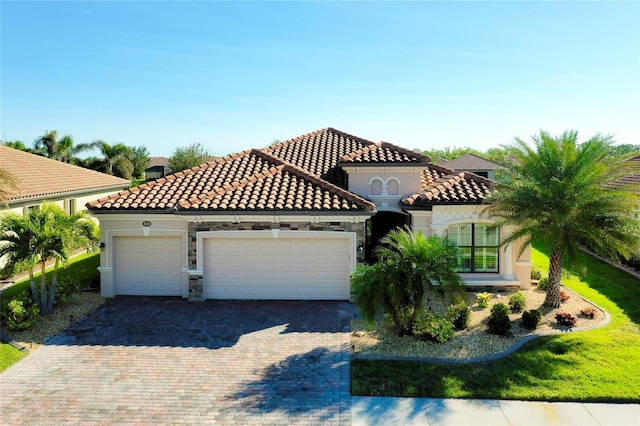 mediterranean / spanish-style house featuring a garage