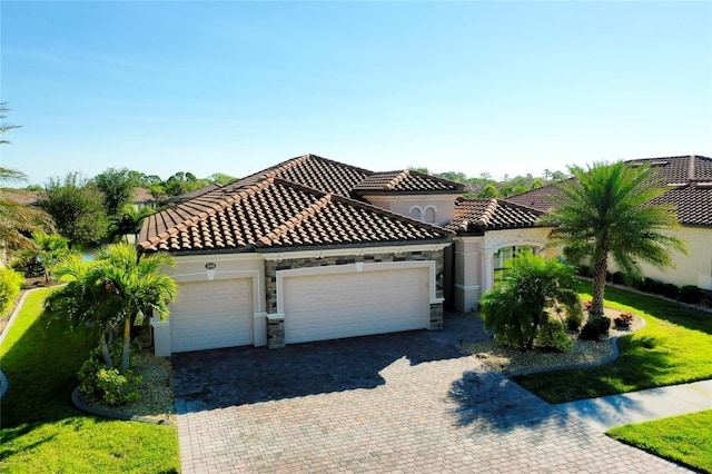 mediterranean / spanish home featuring a garage