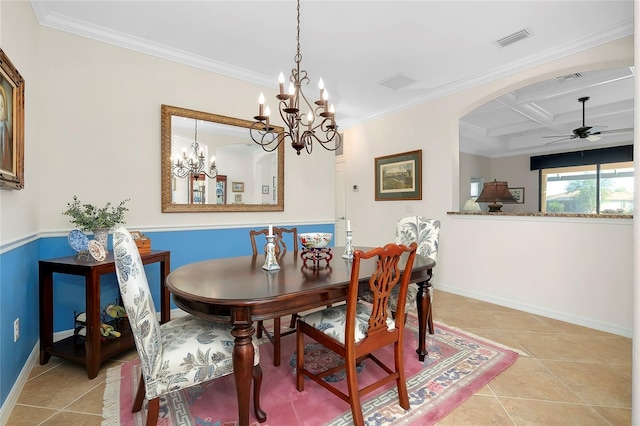 dining area with light tile patterned floors, crown molding, and coffered ceiling