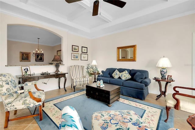 living room with beam ceiling, coffered ceiling, crown molding, light tile patterned flooring, and ceiling fan with notable chandelier