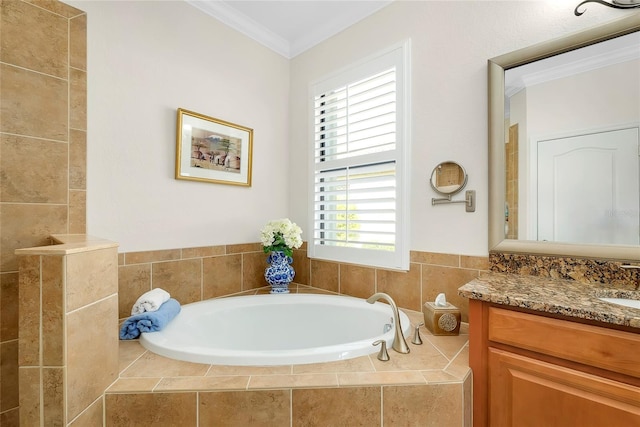 bathroom with vanity, a relaxing tiled tub, and ornamental molding