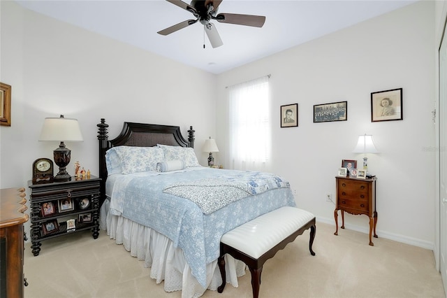 bedroom featuring ceiling fan and light colored carpet