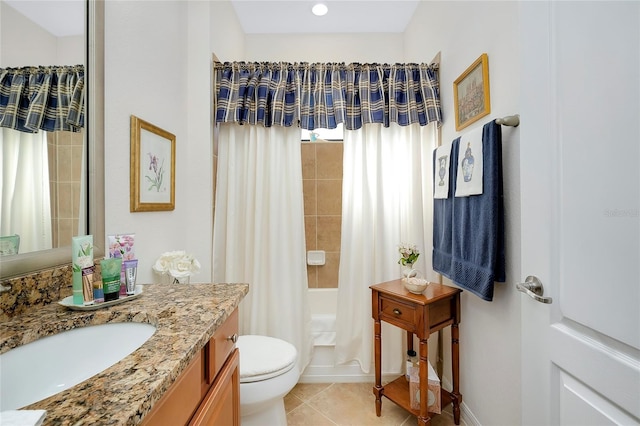 full bathroom featuring vanity, shower / tub combo with curtain, tile patterned flooring, and toilet