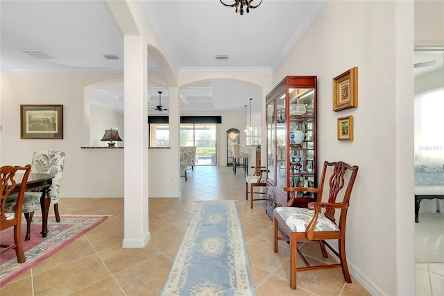 interior space with light tile patterned flooring and crown molding