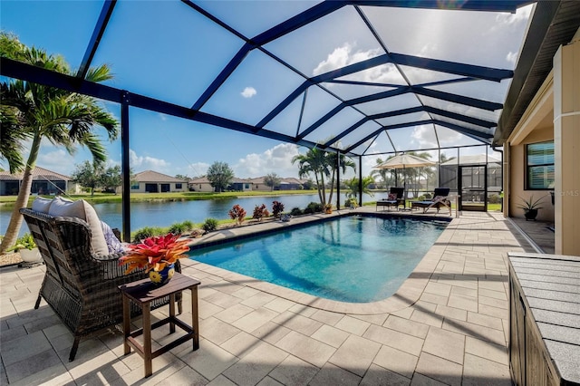 view of swimming pool with a patio, a water view, and glass enclosure