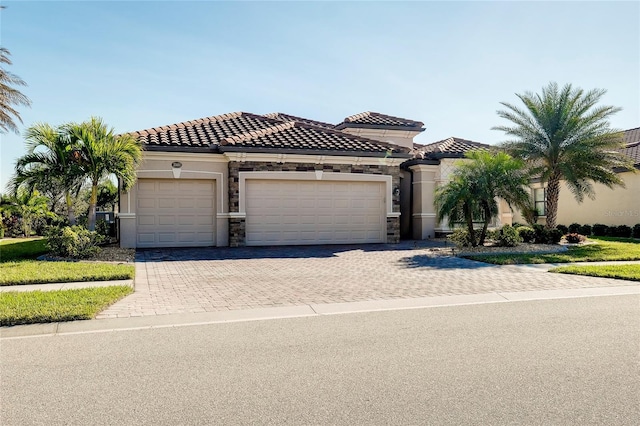 mediterranean / spanish-style home featuring a garage