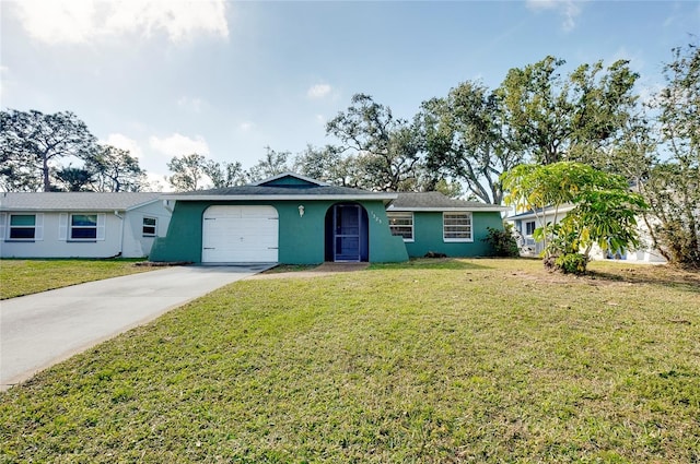 single story home featuring a garage and a front yard