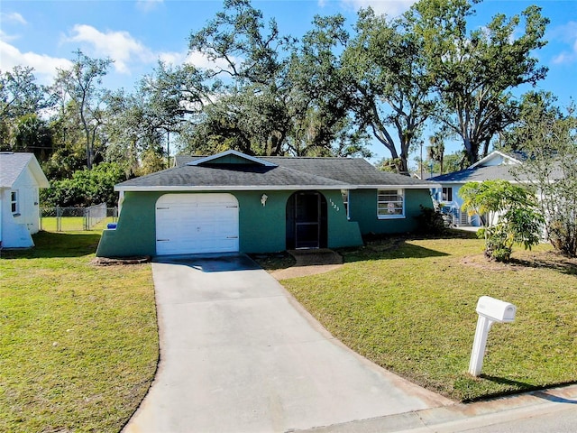 ranch-style home featuring a garage and a front yard