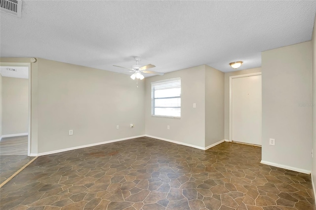 unfurnished room with a textured ceiling and ceiling fan