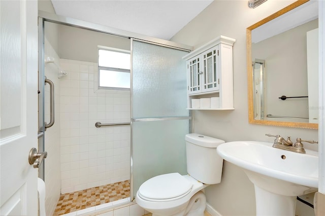 bathroom with sink, toilet, and walk in shower