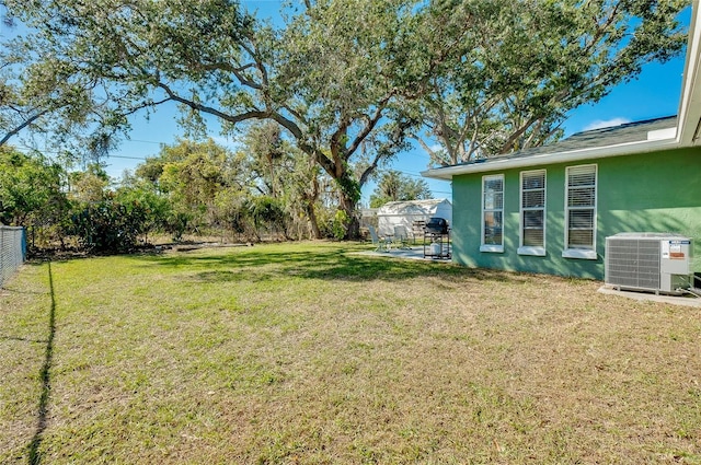 view of yard with central AC