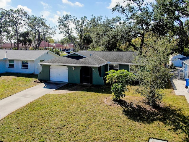 single story home with a garage and a front yard