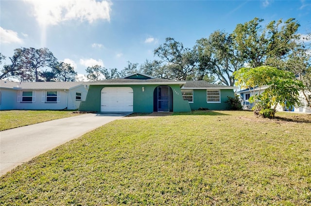 single story home with a garage and a front lawn