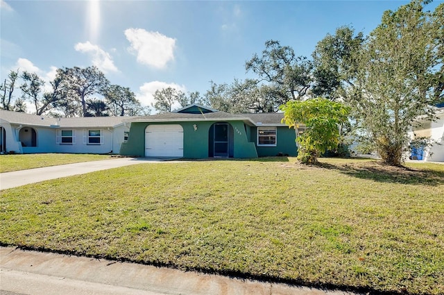 ranch-style home featuring a garage and a front yard