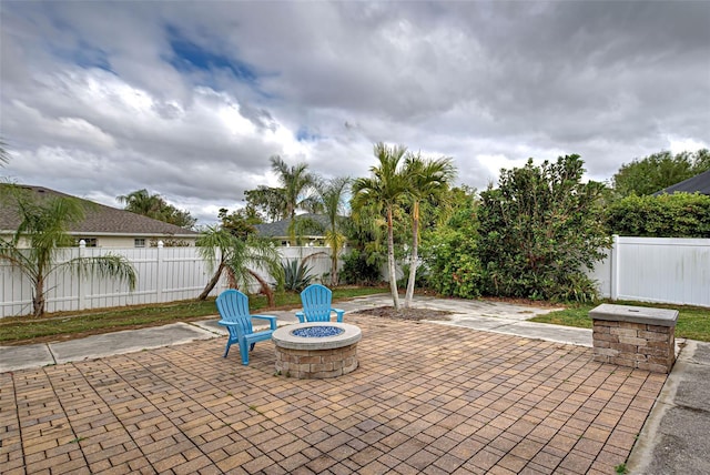 view of patio / terrace with an outdoor fire pit