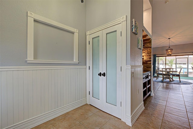 hallway featuring light tile patterned flooring