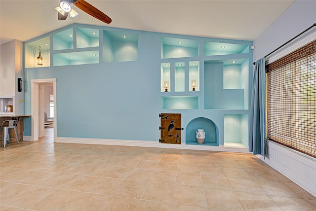 living room featuring ceiling fan, light tile patterned flooring, a healthy amount of sunlight, and high vaulted ceiling