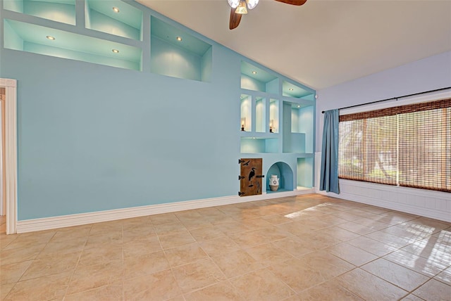 unfurnished living room featuring tile patterned floors, ceiling fan, and high vaulted ceiling