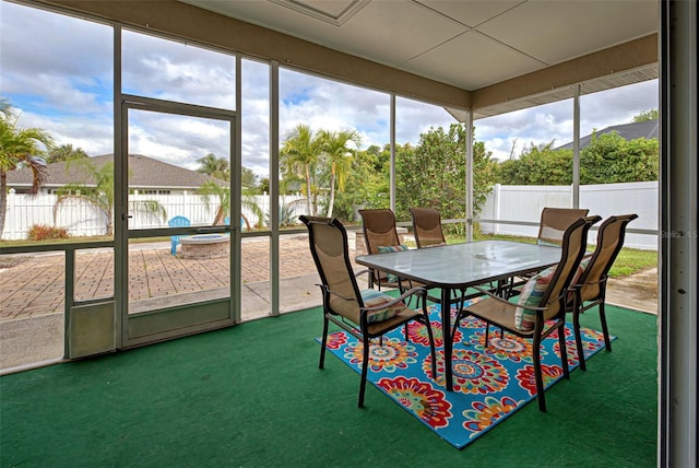 sunroom / solarium featuring plenty of natural light