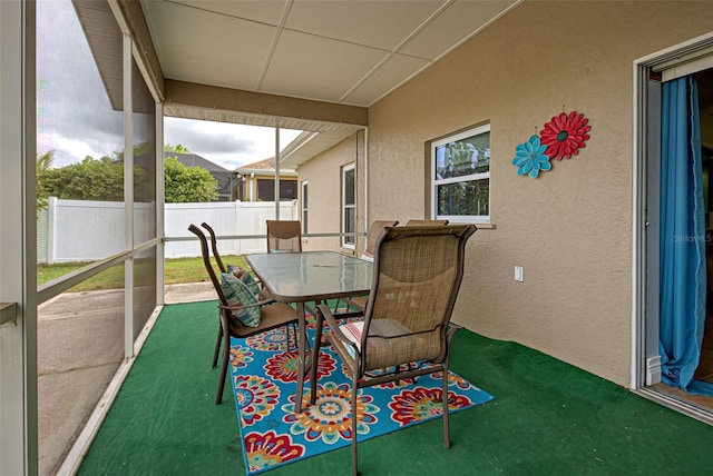 sunroom featuring a drop ceiling