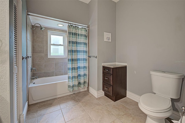 bathroom featuring tile patterned flooring, shower / tub combo, and toilet