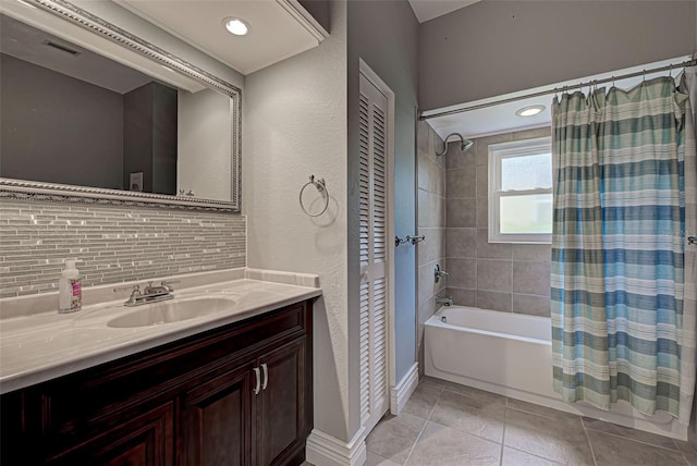 bathroom with tile patterned floors, vanity, shower / tub combo, and tasteful backsplash