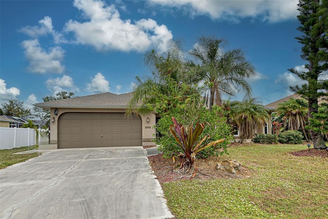 view of front of property with a garage and a front yard