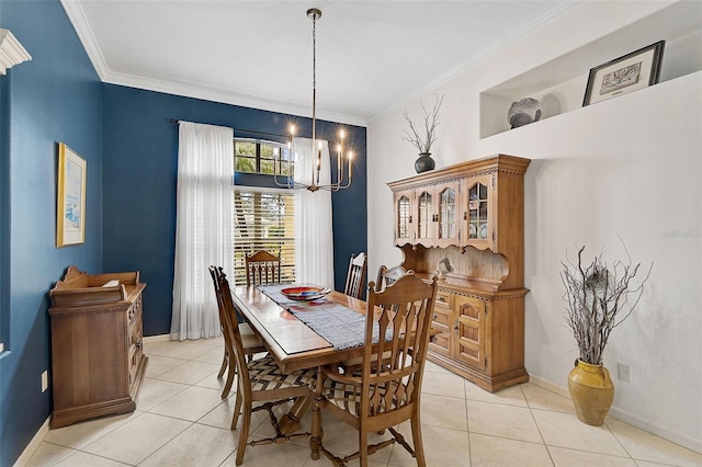 tiled dining room featuring crown molding and a chandelier