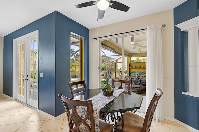 tiled dining room with french doors and ceiling fan