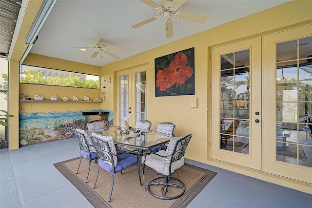 sunroom featuring french doors and ceiling fan