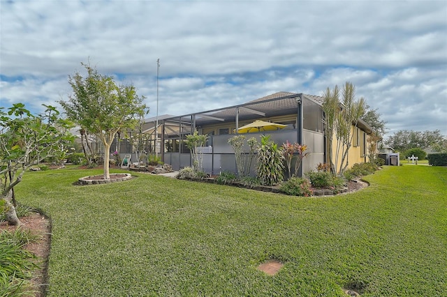 view of yard with a lanai